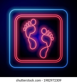 Glowing neon Human footprint icon isolated on black background. Trace of human foot.  Vector
