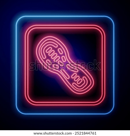 Glowing neon Human footprints shoes icon isolated on black background. Shoes sole.  Vector