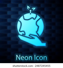 Glowing neon Human hands holding Earth globe icon isolated on brick wall background. Save earth concept.  Vector Illustration