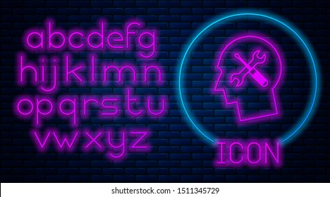 Glowing neon Human head with with screwdriver and wrench icon isolated on brick wall background. Artificial intelligence. Symbol work of brain. Neon light alphabet. Vector Illustration