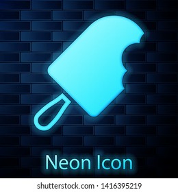 Glowing neon Ice cream icon isolated on brick wall background. Sweet symbol. Vector Illustration