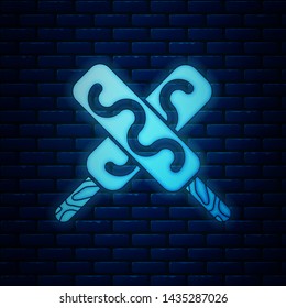 Glowing neon Ice cream icon isolated on brick wall background. Sweet symbol.  Vector Illustration