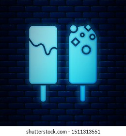 Glowing neon Ice cream icon isolated on brick wall background. Sweet symbol.  Vector Illustration