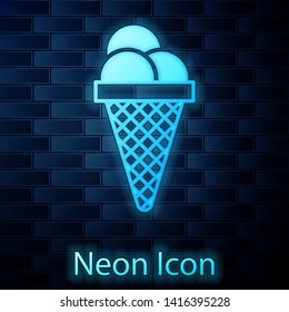 Glowing neon Ice cream in waffle cone icon isolated on brick wall background. Sweet symbol. Vector Illustration