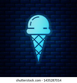 Glowing neon Ice cream in waffle cone icon isolated on brick wall background. Sweet symbol.  Vector Illustration