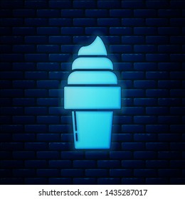 Glowing neon Ice cream in waffle cone icon isolated on brick wall background. Sweet symbol.  Vector Illustration