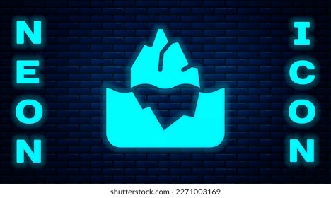 Glowing neon Iceberg icon isolated on brick wall background.  Vector