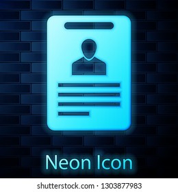 Glowing neon Identification badge icon isolated on brick wall background. Identification card. It can be used for presentation, identity of the company, advertising and etc. Vector Illustration