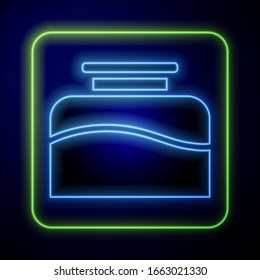 Glowing neon Inkwell icon isolated on blue background.  Vector Illustration