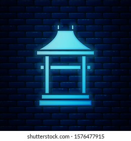 Glowing neon Japan Gate icon isolated on brick wall background. Torii gate sign. Japanese traditional classic gate symbol.  Vector Illustration