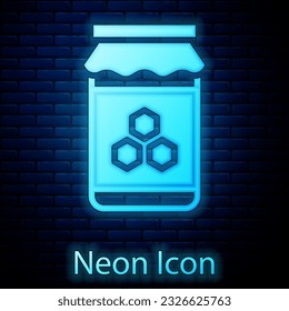 Glowing neon Jar of honey icon isolated on brick wall background. Food bank. Sweet natural food symbol.  Vector