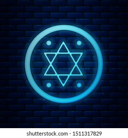 Glowing neon Jewish coin icon isolated on brick wall background. Currency symbol.  Vector Illustration