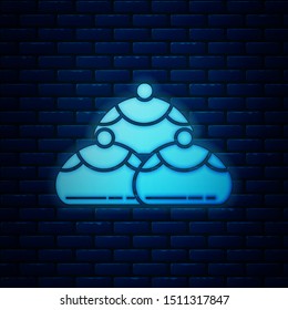 Glowing neon Jewish sweet bakery icon isolated on brick wall background. Hanukkah sufganiyot. Jewish easter cake.  Vector Illustration