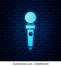 Glowing neon Joystick for arcade machine icon isolated on brick wall background. Joystick gamepad.  Vector Illustration
