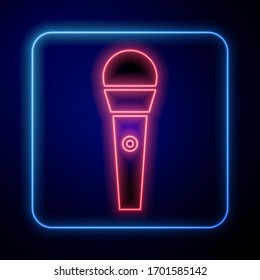 Glowing neon Karaoke icon isolated on blue background. Microphone and monitor.  Vector Illustration