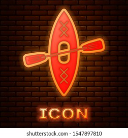 Glowing neon Kayak and paddle icon isolated on brick wall background. Kayak and canoe for fishing and tourism. Outdoor activities.  Vector Illustration