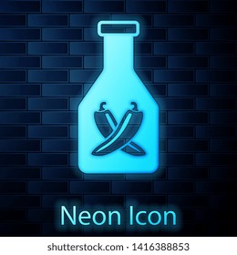 Glowing neon Ketchup bottle icon isolated on brick wall background. Hot chili pepper pod sign. Barbecue and BBQ grill symbol. Vector Illustration