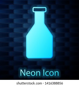 Glowing neon Ketchup bottle icon isolated on brick wall background. Vector Illustration