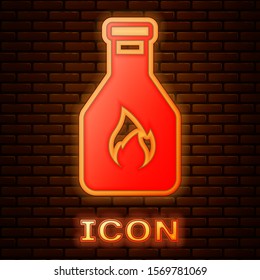 Glowing neon Ketchup bottle icon isolated on brick wall background.  Vector Illustration