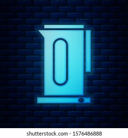 Glowing neon Kettle with handle icon isolated on brick wall background. Teapot icon.  Vector Illustration