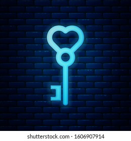 Glowing neon Key in heart shape icon isolated on brick wall background. Valentines day.  Vector Illustration