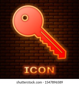 Glowing neon Key icon isolated on brick wall background.  Vector Illustration