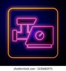 Glowing neon Kitchen meat grinder icon isolated on black background.  Vector