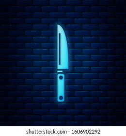 Glowing neon Knife icon isolated on brick wall background. Cutlery symbol.  Vector Illustration