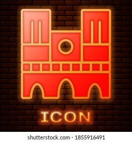 Glowing neon Landmark of France Notre Dame de Paris icon isolated on brick wall background. Vector.
