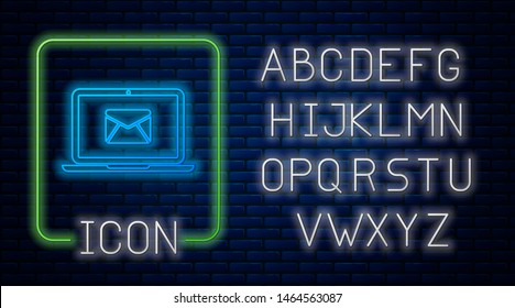 Glowing neon Laptop with envelope and open email on screen icon isolated on brick wall background. Email marketing, internet advertising concepts. Neon light alphabet. Vector Illustration