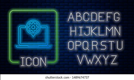 Glowing neon Laptop and gear icon isolated on brick wall background. Laptop service concept. Adjusting app, setting options, maintenance, repair, fixing. Neon light alphabet. Vector Illustration
