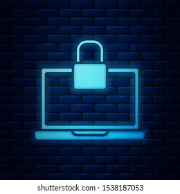 Glowing neon Laptop and lock icon isolated on brick wall background. Computer and padlock. Security, safety, protection concept. Safe internetwork.  Vector Illustration