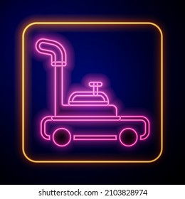 Glowing neon Lawn mower icon isolated on black background. Lawn mower cutting grass.  Vector