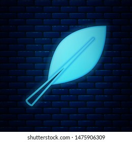 Glowing neon Leaf icon isolated on brick wall background. Fresh natural product symbol.  Vector Illustration