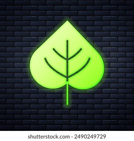 Glowing neon Leaf icon isolated on brick wall background. Leaves sign. Fresh natural product symbol.  Vector