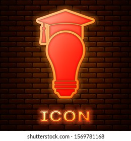 Glowing neon Light bulb and graduation cap icon isolated on brick wall background. University Education concept.  Vector Illustration