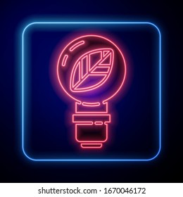 Glowing neon Light bulb with leaf icon isolated on blue background. Eco energy concept. Alternative energy concept.  Vector Illustration