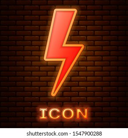Glowing neon Lightning bolt icon isolated on brick wall background. Flash icon. Charge flash icon. Thunder bolt. Lighting strike.  Vector Illustration