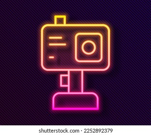 Glowing neon line Action extreme camera icon isolated on black background. Video camera equipment for filming extreme sports.  Vector