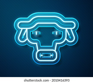 Glowing neon line African buffalo head icon isolated on blue background. Mascot, african savanna animal. Wild ox, carabao or bison bull with fused horns.  Vector