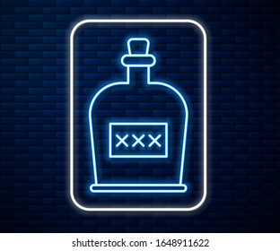 Glowing neon line Alcohol drink Rum bottle icon isolated on brick wall background.  Vector Illustration