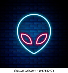 Glowing neon line Alien icon isolated on brick wall background. Extraterrestrial alien face or head symbol. Colorful outline concept. Vector