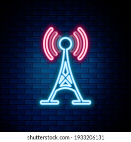 Glowing neon line Antenna icon isolated on brick wall background. Radio antenna wireless. Technology and network signal radio antenna. Colorful outline concept. Vector