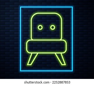 Glowing neon line Armchair icon isolated on brick wall background.  Vector