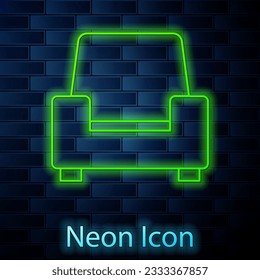 Glowing neon line Armchair icon isolated on brick wall background.  Vector