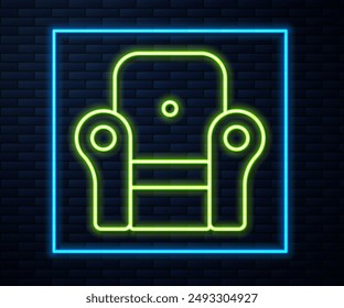 Glowing neon line Armchair icon isolated on brick wall background.  Vector