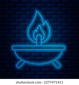 Glowing neon line Aroma candle icon isolated on brick wall background.  Vector