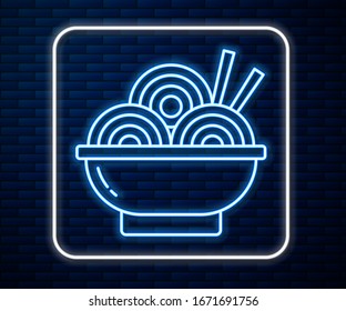 Glowing neon line Asian noodles in bowl and chopsticks icon isolated on brick wall background. Street fast food. Korean, Japanese, Chinese food.  Vector Illustration