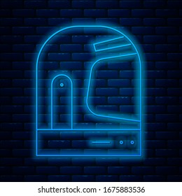 Glowing neon line Astronaut helmet icon isolated on brick wall background.  Vector Illustration