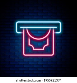 Glowing neon line ATM - Automated teller machine and money icon isolated on brick wall background. Colorful outline concept. Vector